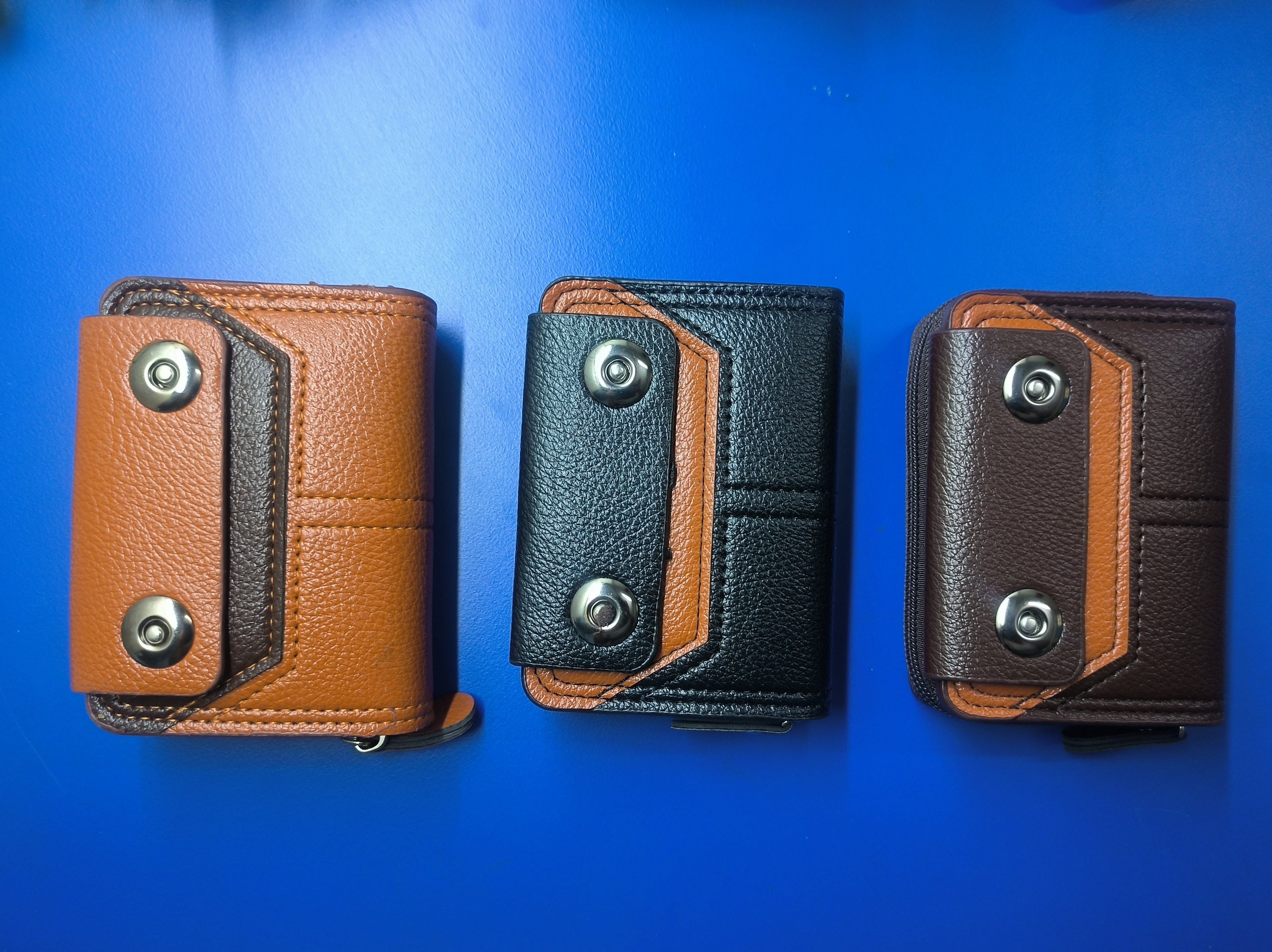 Front view of the credit card holder with three colour options